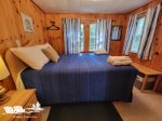 Backside bedroom with pine paneling
